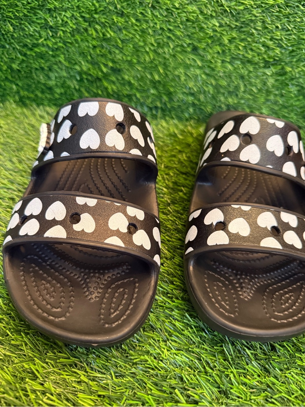 Crocs, unisex Black Slide Sandals with White Heart Print men 7.0 women 9.0